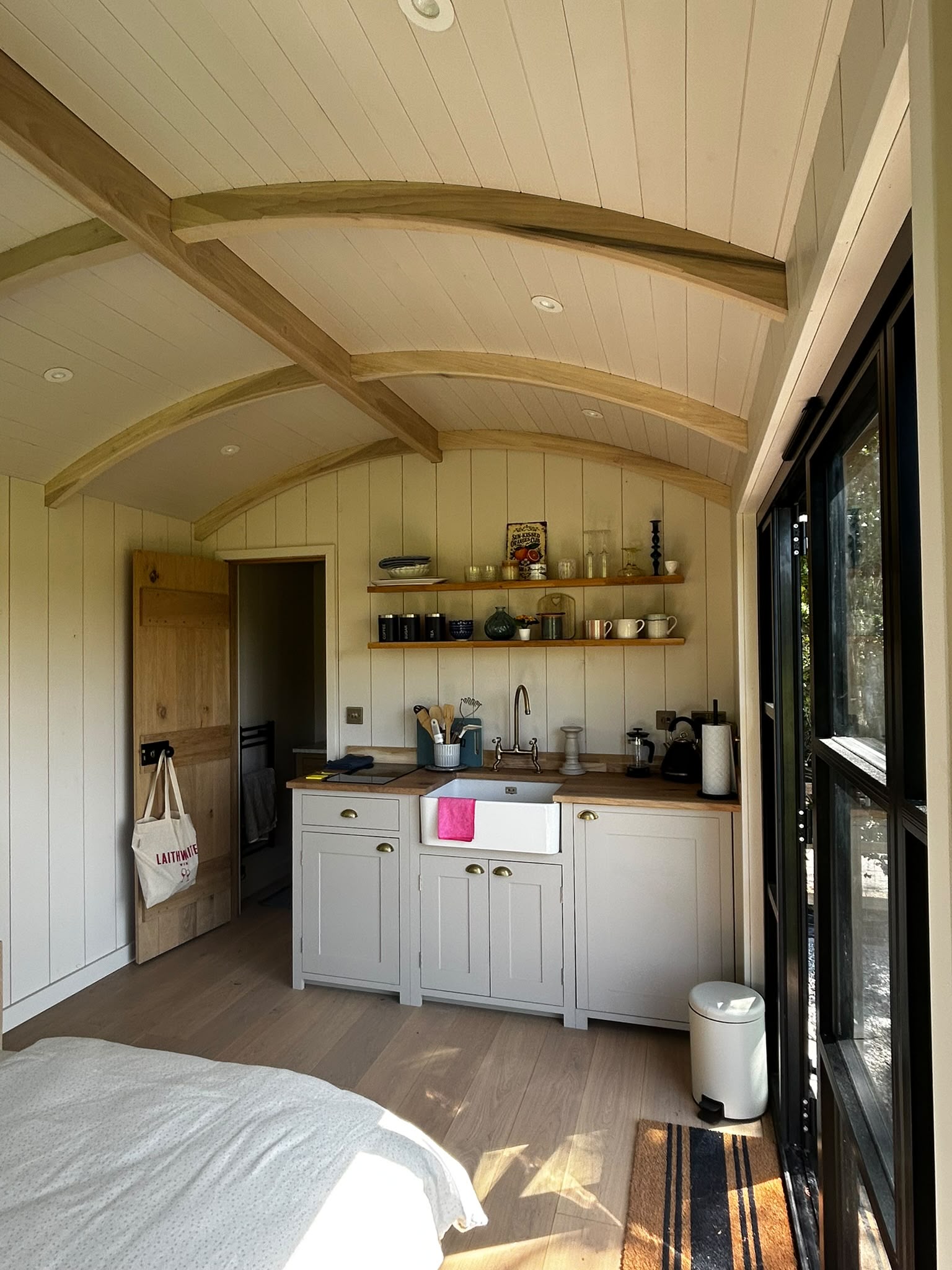 Interior of Keeper's Hide showing the curved beamed ceiling, kitchenette and bed